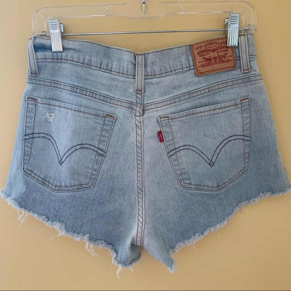 Levi’s frayed jean shorts fits a size medium